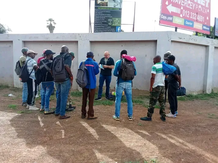 Volunteer distributing scripture cards