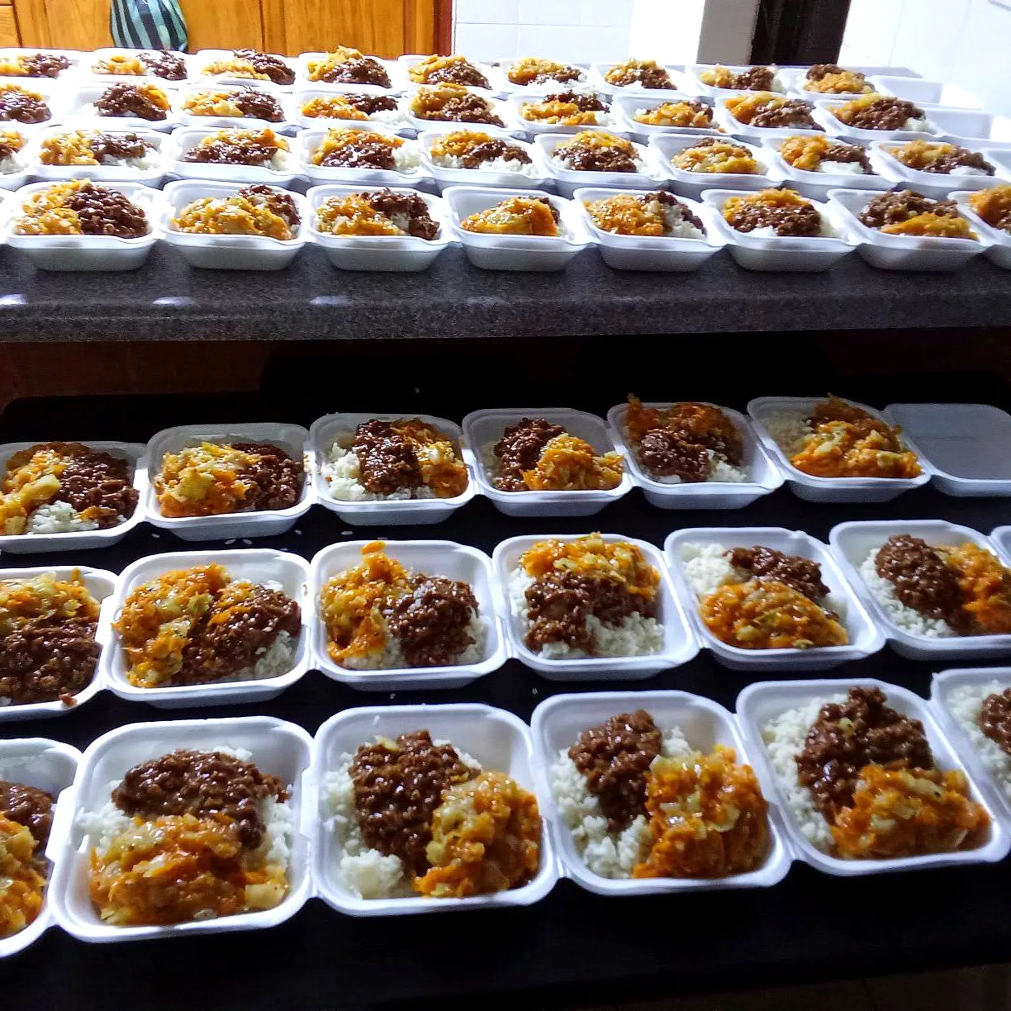 Hot meals portioned and ready for distribution to those in need